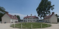 Built in classic Palladian style, the home's west side is flanked by advancing single-story secondary wings creating a cour d'honneur.