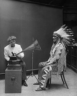 Frances Densmore plays a recording for chief Mountain Chief for the Bureau of American Ethnology in 1916.