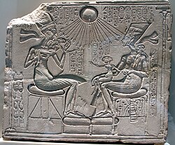 A sunk-relief depiction of Pharaoh Akhenaten with his wife Nefertiti and daughters. The main background has not been removed, merely that in the immediate vicinity of the sculpted form. Note how strong shadows are needed to define the image.