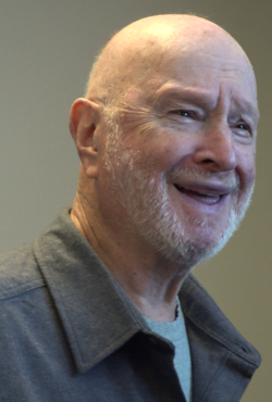 Feiffer laughing during a panel at Butler Library at Columbia University in 2016