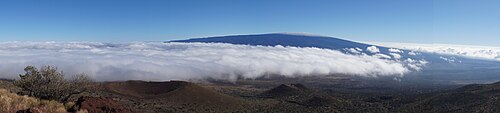 A view of Mauna Loa taken from a hill near The Onizuka Center for International Astronomy Visitor Information Station at the 9,300 ft (2,800 m) level of Mauna Kea.