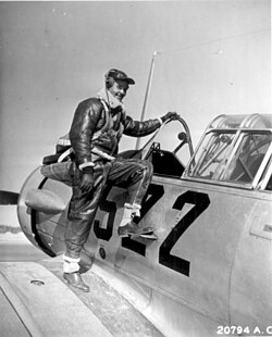 Captain Benjamin Oliver Davis Jr. of Washington, D.C., climbing into an Advanced Trainer (Tuskegee, Alabama; January 1942).