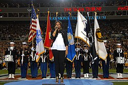 Jennifer Hudson sings the national anthem at Super Bowl XLIII.