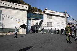 The entrance to Evin Prison, established in 1972. VICE describes the prison as the "legendary terrifying place that nobody wants to end up."[413]