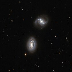 Figure 7: Tidal force is responsible for the merge of galactic pair MRK 1034.[16]