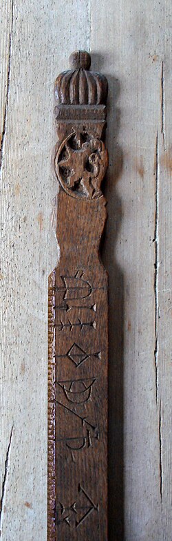Detail of 17th century calendar stick carved with national coat of arms, a common motif in Norwegian folk art.