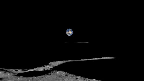 A simulated view of Earth from the vicinity of Shackleton Crater, visible as a thin illuminated rim