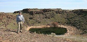 One of many kolk-formed depressions or "potholes" in the channeled scablands in eastern Washington at WikiMiniAtlas46°54′21.40″N 119°16′47″W﻿ / ﻿46.9059444°N 119.27972°W﻿ / 46.9059444; -119.27972.