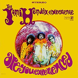 Album cover of Are You Experienced (1967) by The Jimi Hendrix Experience; the photographer captured the trio with a fisheye lens on color infrared film