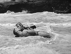 Kerr with Burt Lancaster in the iconic scene of From Here to Eternity (1953)