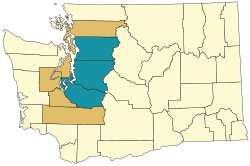 The Seattle metropolitan area is shown in light blue. The Combined Statistical Area consists of both the blue and gold areas.