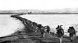 Chinese forces cross the frozen Yalu River