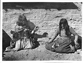 Two Mojave Indian women playing a game (fortune-telling), c. 1900