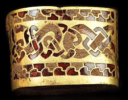c. 7th century AD, Anglo-Saxon seax hilt fitting – gold with gemstone inlay of garnet cloisonné. From the Staffordshire Hoard, found in 2009, and not fully cleaned