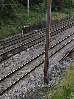 Corroding steel gantry on an electrified railway line
