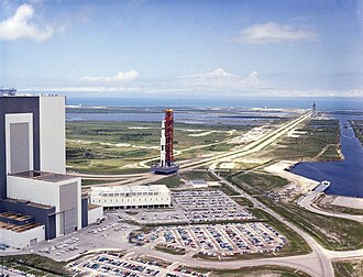 Saturn V SA-506, the rocket carrying the Apollo 11 spacecraft, moves out of the Vehicle Assembly Building towards Launch Complex 39.