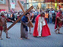 Station 5: Simon of Cyrene helps Jesus carry the Cross, Good Friday procession 2011 at Ulm, Germany