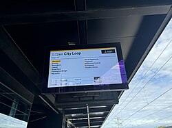 A PID on Platform 1 displaying a Flinders Street via City Loop service, August 2024