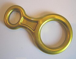 This climbing descender is anodized with a yellow finish.