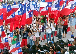 Chileans carrying flags in the National Sanctuary of Maipú