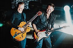 Adams and Keith Scott during a concert in 2012
