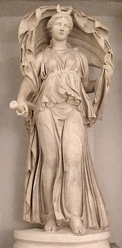 Statue of Selene, shown wearing the crescent on her forehead and holding a torch in her right hand, while her veil billows over her head.