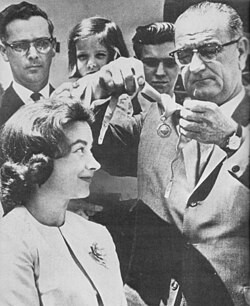 President Lyndon Johnson awards Mock the Federal Aviation Agency Gold Medal for Exceptional Service on May 4, 1964