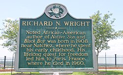 A historic marker in Natchez, Mississippi, commemorating Wright, who was born near the city