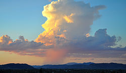 Isolated towering vertical desert shower