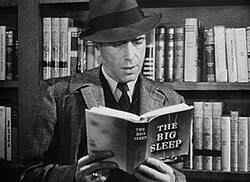 Humphrey Bogart as Philip Marlowe reading Raymond Chandler's The Big Sleep