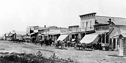 Dodge City in 1875 with the Beatty and Kelley Restaurant at the corner of First Avenue and Front Street