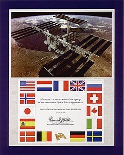 A commemorative plaque honouring the Space Station Intergovernmental Agreement (IGA) for the International Space Station, signed on 28 January 1998 and symbolic for the increasing diversification and internationalization of spaceflight since its beginning