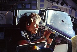 Using binoculars to view Earth during STS-41-G
