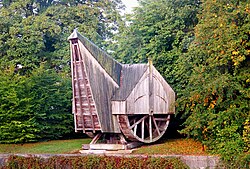 Interior of a medieval treadwheel crane in Bruges, Belgium, showing the wooden wheel mechanism powered by human walking
