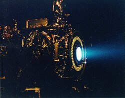 A xenon ion engine being tested at NASA's Jet Propulsion Laboratory, 1999
