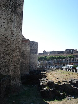 Wall of the Castello Ursino, with the 1669 lava flow on the right