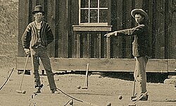 Detail from photograph purporting to show Bonney (left) playing croquet in 1878