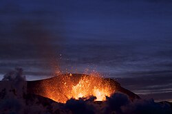 Magma bubbles exerting a volcano during an eruption.