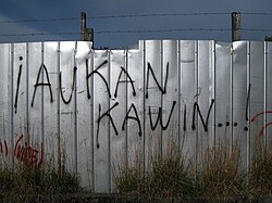Graffiti in Mapudungun meaning "Uprise Meeting...!"