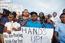 "Hands up!" sign displayed at a Ferguson protest