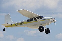 Cessna 180G with belly cargo pod and tundra tires