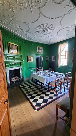 George Washington's Mount Vernon dining room, noted for its unique color, a result of copper paint, and its ornate ceiling work