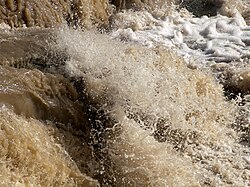 Turbid creek water caused by heavy rains