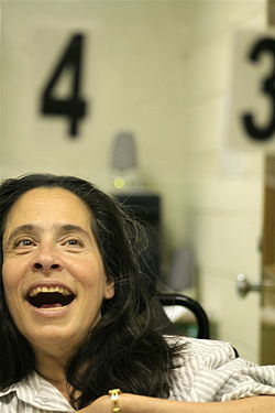 An AAC user uses number coding on an eye gaze communication board.