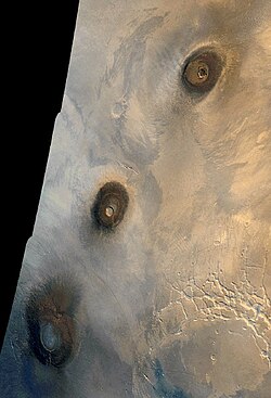 Viking orbiter image of the three Tharsis Montes: Arsia Mons (bottom), Pavonis Mons (center), and Ascraeus Mons (top)
