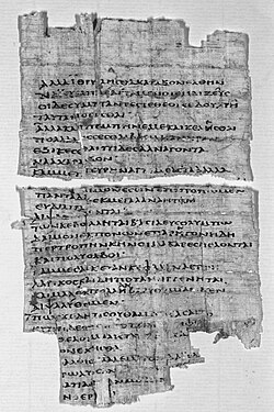 Black and white photograph of a fragment of papyrus with Greek text