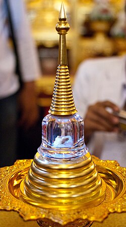 A relic found amid the ashes of Chan Kusalo (the Buddhist Patriarch of Northern Thailand) is placed inside a chedi shaped vial and displayed inside Wat Chedi Luang in Chiang Mai.