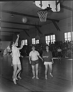 A basketball game between the Heart Mountain and Powell High School girls teams, Wyoming, March 1944