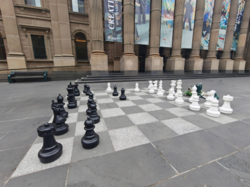 One of the forecourt's large chessboards