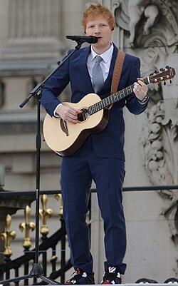 Sheeran playing in front of Buckingham Palace during the Queen's Platinum Jubilee in June 2022